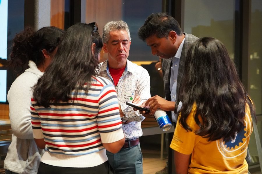 Dr. Fernando Pérez and Dr. Sunny Kishore talking with a group of students