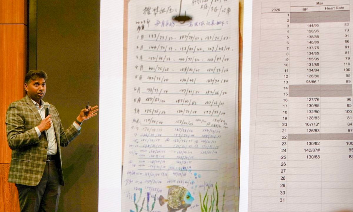 Dr. Sunny Kishore presenting a patient&rsquo;s handwritten blood pressure log beside a spreadsheet of readings